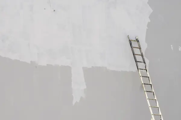 Exterior painting in Sioux Falls: ladder against a freshly primed wall
